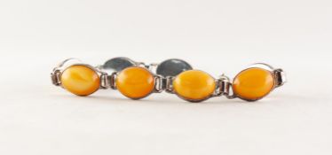 SILVER COLOURED METAL BRACELET with eight cabochon OVAL BUTTERSCOTCH AMBER set links (925 mark)