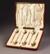 GEORGE VI SILVER GILT AND HARLEQUIN GUILLOCHE ENAMELLED CASED SET OF SIX COFFEE SPOONS, the backs of