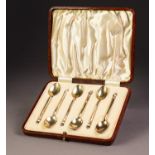 GEORGE VI SILVER GILT AND HARLEQUIN GUILLOCHE ENAMELLED CASED SET OF SIX COFFEE SPOONS, the backs of