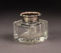 GEORGE V CUT GLASS INKWELL WITH SILVER COLLAR AND HINGED COVER, of square form with ?pie crust?