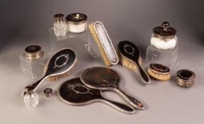 AN EARLY TWENTIETH CENTURY COMPOSITE SUITE OF SILVER AND TORTOISESHELL DRESSING TABLE ITEMS,