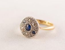 18ct GOLD AND PLATINUM RING, the circular top pave set with three sapphires and four small diamonds,