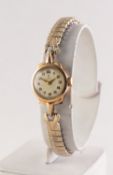 LADY?S TUDOR 9ct GOLD CASED WRIST WATCH, 17 rubies, Arabic dial, Edinburgh 1963, on an expanding