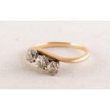 18ct GOLD CROSS-OVER RING set with three old cut diamonds, eah approximately 0.20ct, 0.60ct in