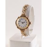 RIVAL, LADY'S 9ct GOLD WRISTWATCH with 15 jewels movement, gilt decorated white porcelain Arabic