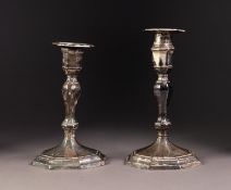 GEORGE V PAIR OF WEIGHTED SILVER CANDLESTICKS, each of slender panelled oviform with octagonal base,