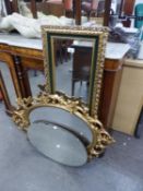 AN OVAL ORNATE MIRROR, IN GILT FRAME AND ANOTHER WALL MIRROR AND A FRAMELESS WALL MIRROR (3)