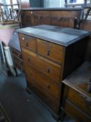 AN OAK JACOBEAN STYLE PART BEDROOM SUITE, VIZ A DRESSING CHEST WITH OVAL SWING MIRROR, A CHEST OF