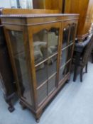 MAHOGANY TWO-DOOR DISPLAY CABINET ON STUMP CABRIOLE SUPPORTS