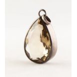 SILVER COLOURED METAL PENDANT, framing a large tear shaped citrine