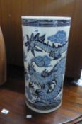 ORIENTAL POTTERY CYLINDRICAL STICK STAND, WITH DRAGON DECORATION