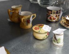 THREE EARLY TWENTIETH CENTURY ROYAL WORCESTER PORCELAIN BLUSHED IVORY GROUND MINIATURE ITEMS VIZ A