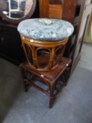 A BAMBOO CIRCULAR STOOL WITH LOOSE  CUSHION AND A BROWN STAINED BAMBOO SQUARE COFFEE TABLE WITH CANE