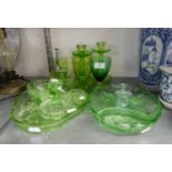 A GREEN GLASS MOULDED GLASS DRESSING TABLE SET OF FIVE PIECES AND A SIMILAR PAIR OF TALL