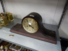 A MANTEL CLOCK WITH 8 DAYS STRIKING MOVEMENT, IN MAHOGANY LARGE NAPOLEON?S HAT SHAPED CASE