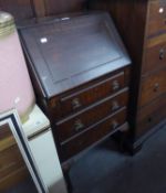 MAHOGANY SMALL BUREAU HAVING THREE DRAWERS AND WRITING FALL OWN SECTION ON CABRIOLE LEGS
