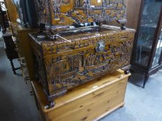 CHINESE CARVED CAMPHOR WOOD BLANKET CHEST CAVÉ RELIEVO WITH FIGURES AND SCENES, RAISED ON FEET, 2?