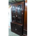 A MAHOGANY SMALL LIBRARY BOOKCASE WITH TWO ASTRAGAL GLAZED DOORS, ON AN ADVANCED CUPBOARD BASE, 3?
