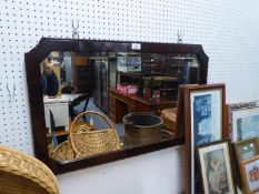 AN OBLONG BEVELLED EDGE WALL MIRROR, IN OAK FRAME