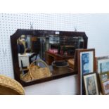 AN OBLONG BEVELLED EDGE WALL MIRROR, IN OAK FRAME