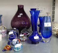 A LARGE PURPLE GLASS VASE, SIX COLOURED GLASS PAPERWEIGHTS, TREE BLUE GLASS VASES, OTHER GLASS WARES