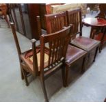 A SET OF FOUR OAK RAIL BACK DINING CHAIRS, WITH DROP-IN SEATS, INCLUDING A CARVER?S ARMCHAIR (4)