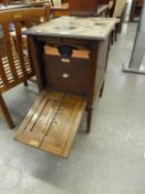 AN OAK GRAMOPHONE CABINET WITH FALL-FRONT END RECORD COMPARTMENTS AND A SELECTION OF 78 RPM RECORDS