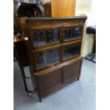 A MINTY MAHOGANY AND LEAD LIGHT GLAZED THREE TIER SECTIONAL BOOKCASE