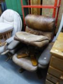 A BROWN HIDE COVERED REVOLVING EASY ARMCHAIR AND MATCHING STOOL