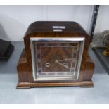 AN ART DECO WALNUT CASED MANTEL CLOCK WITH SQUARE DIAL