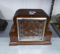 AN ART DECO WALNUT CASED MANTEL CLOCK WITH SQUARE DIAL