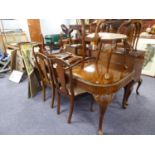 A QUEEN ANNE STYLE BURR WALNUT DINING ROOM SUITE OF NINE PIECES, COMPRISING OF  A LARGE DINING