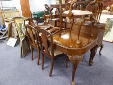 A QUEEN ANNE STYLE BURR WALNUT DINING ROOM SUITE OF NINE PIECES, COMPRISING OF  A LARGE DINING