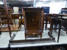 AN OAK OCCASIONAL TABLE, HAVING SPIRAL COLUMNS, SUNBURST WOODEN FIRESCREEN AND A COPPER FIRE CURB (