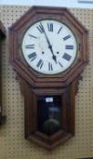 A 19TH CENTURY OAK ANSONIA, AMERICAN, DROP DIAL WALL CLOCK WITH STRIKING MOVEMENT (LACKS GLASS)