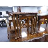 A NEST OF THREE QUEEN ANNE STYLE BURR WALNUT COFFEE TABLES, WITH GLASS INSET TOPS