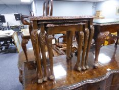 A NEST OF THREE QUEEN ANNE STYLE BURR WALNUT COFFEE TABLES, WITH GLASS INSET TOPS