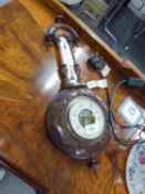 A BANJO SHAPED ANEROID BAROMETER