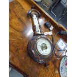 A BANJO SHAPED ANEROID BAROMETER