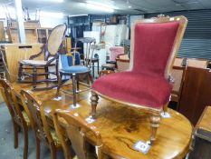 A LATE VICTORIAN WALNUTWOOD FRAMED DRAWING ROOM LOW SEAT CHAIR, COVERED IN RED VELOUR, ALSO A