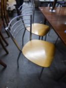 A SET OF FOUR CHROMED TUBULAR METAL KITCHEN CHAIRS, MOULDED WOODEN SEAT