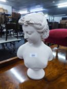 A SMALL POTTERY CREAM COLOURED BUST OF A YOUNG LADY (14" HIGH)