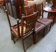 A SET OF SIX OAK RAIL BACK DINING CHAIRS, WITH DROP-IN SEATS, INCLUDING A CARVER?S ARMCHAIR (6) (5 +