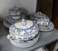 AN EARLY 20TH CENTURY ENGLISH POTTERY ?ZEELAND? PATTERN DINNER SERVICE WITH BLUE PRINTED AND