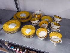 A 1920's/30's THOMAS MORRIS CROWN CHELSEA CHINA 40 PIECE TEA SERVICE, WITH CANARY YELLOW AND BLACK