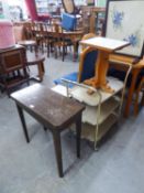 A SMALL OAK SWIVEL AND FLAP TOP CARD TABLE; A PAIR OF PINE PEDESTAL COFFEE TABLES WITH TILED TOPS; A