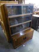 MINTY MAHOGANY FOUR TIER SECTIONAL BOOKCASE, HAVING THREE SLIDING GLASS DOORS  TO UPPER SECTION