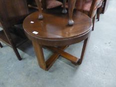 ART DECO WALNUT CIRCULAR COFFEE TABLE ON FOUR CURVED CONTINUOUS FLAT SUPPORTS FORMING THE SALTIRE