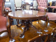 A CIRCULAR, BURR WALNUT VENEERED, LOW CENTRE TABLE ON SHORT COLUMN AND SCROLLED QUARTETTE