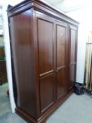 A MODERN MAHOGANY WILLIS AND GAMBIER TRIPLE DOOR WARDROBE (6'6" high x 5'10" wide x 2'2" diameter)